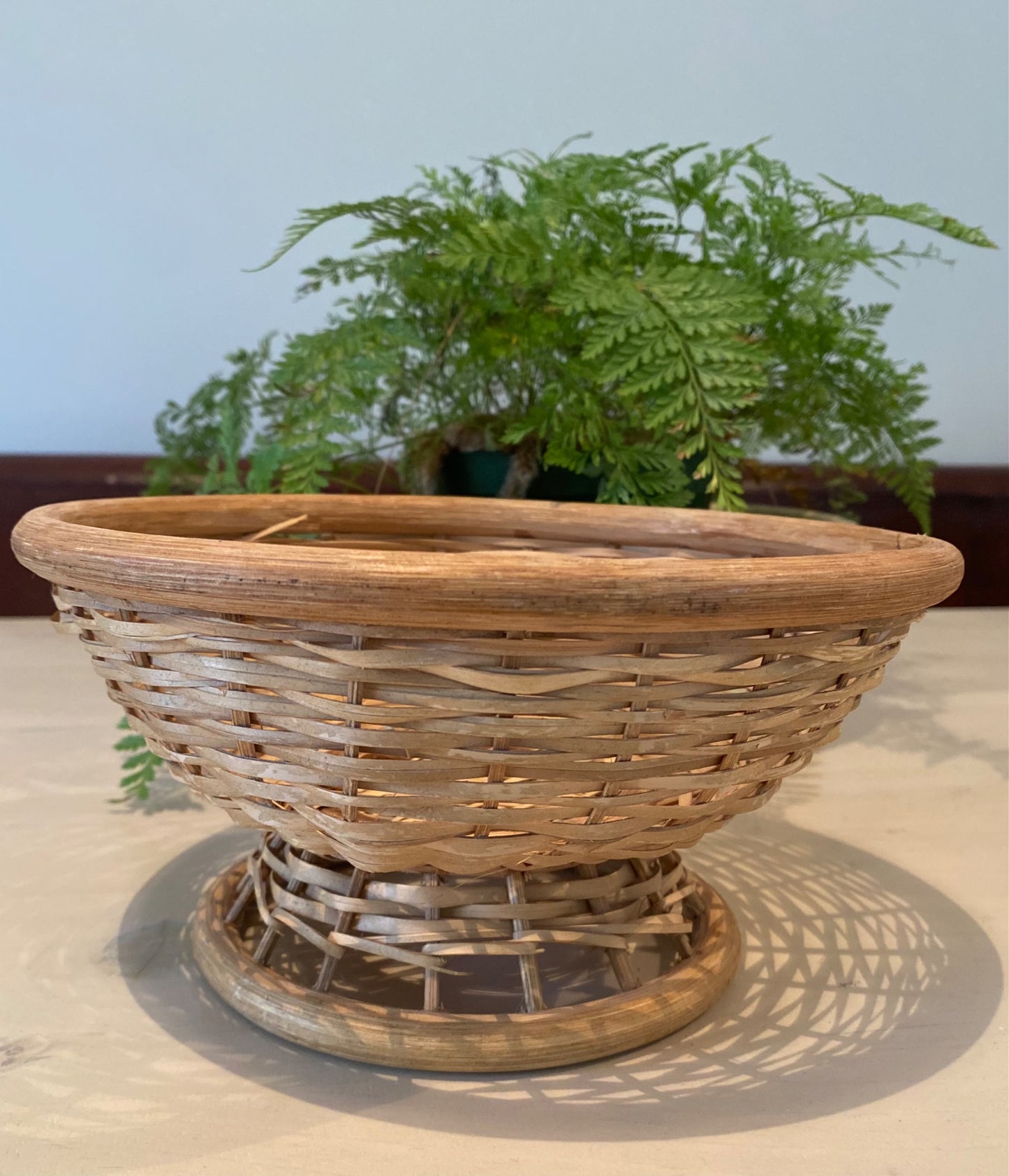 Wicker basket on stand