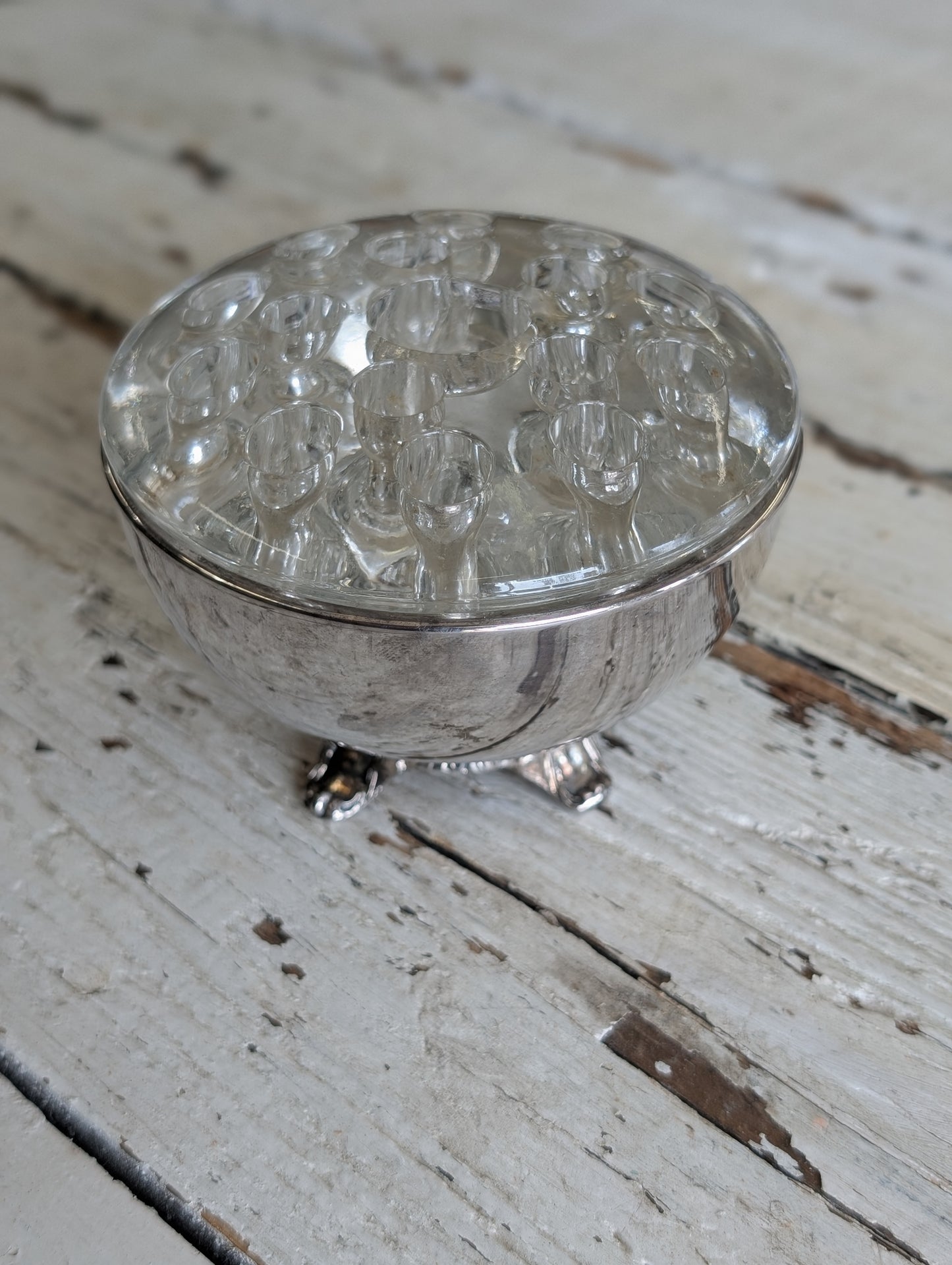 Flower frog in silver bowl