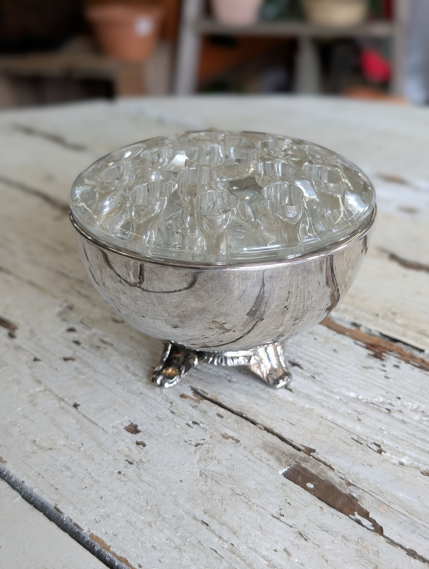 Flower frog in silver bowl