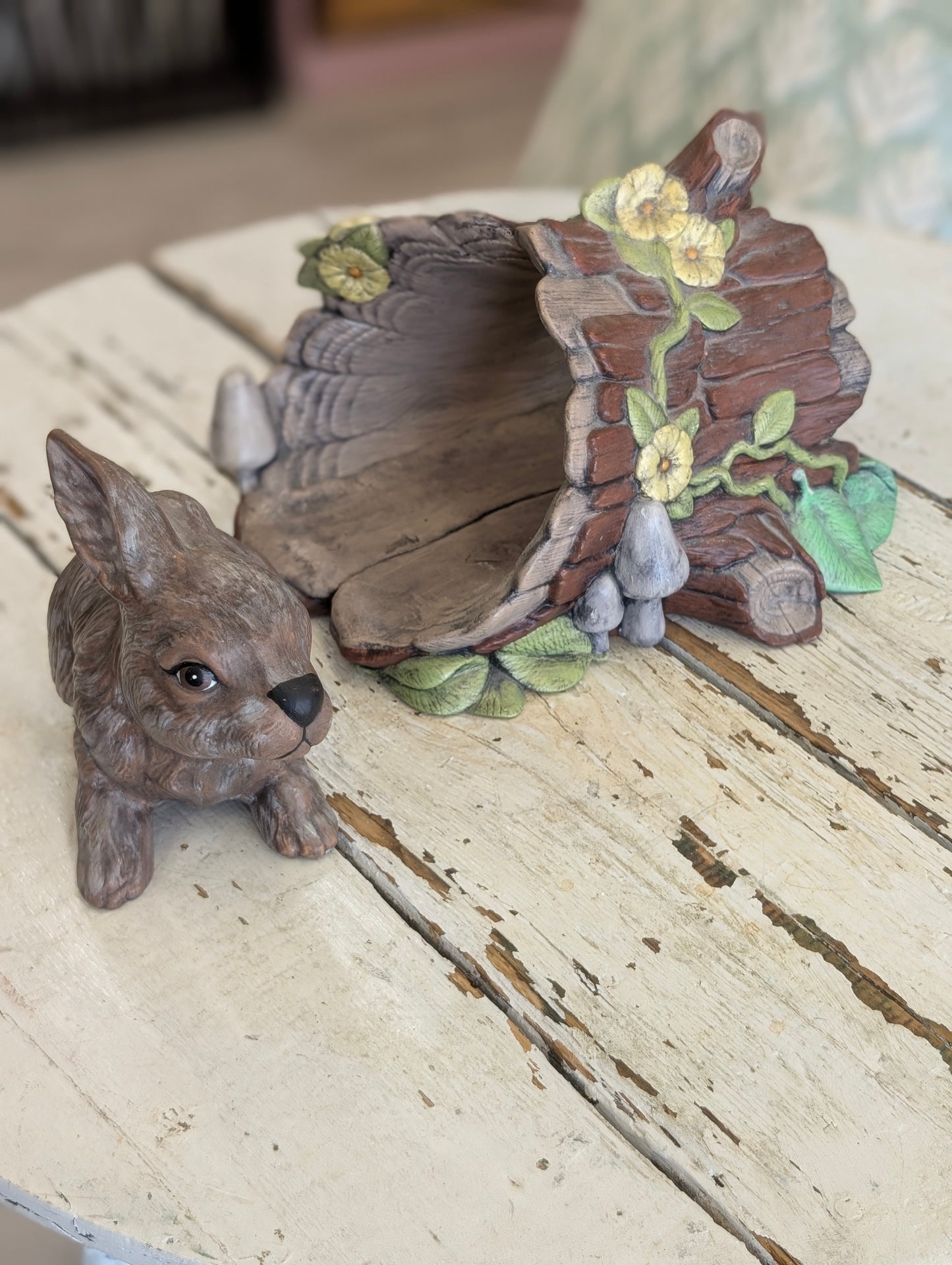 Ceramic bunny and log