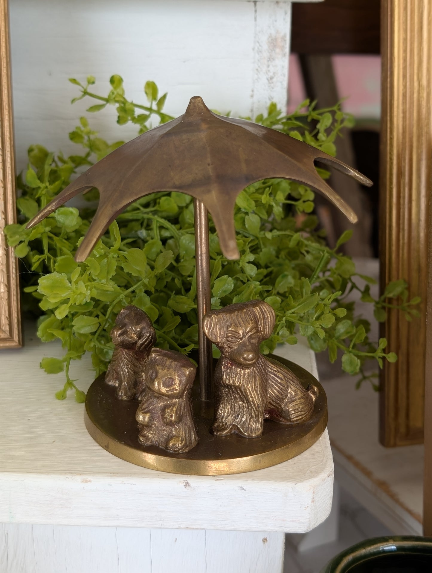 brass puppies with umbrella