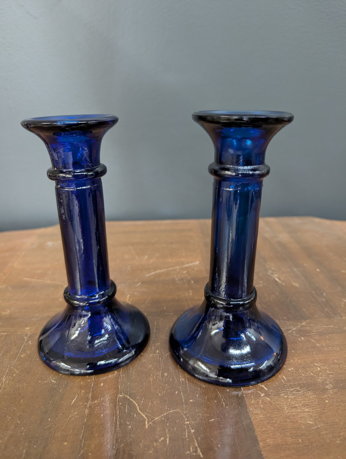 Set of blue glass candle sticks