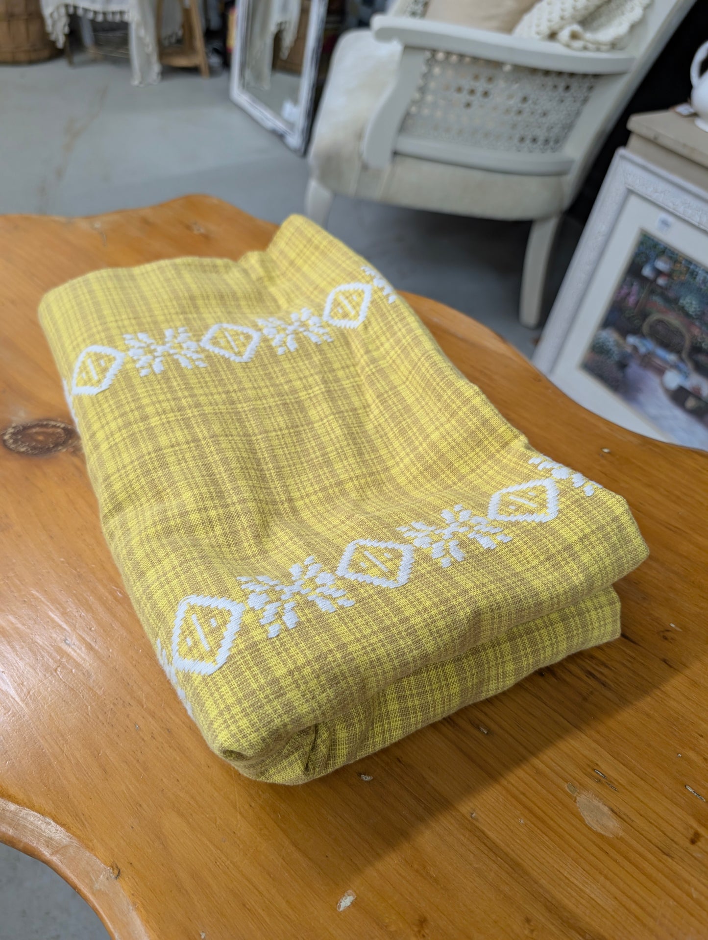 Yellow and white table cloth