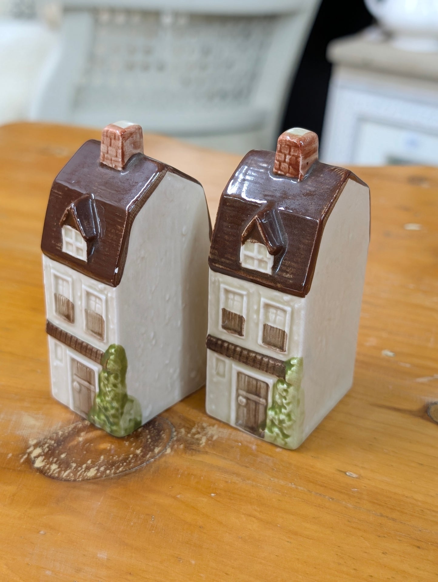 A pair of vintage Otagiri ceramic Victorian townhouse salt and pepper shakers