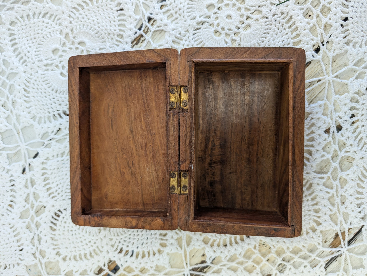 hand-carved wooden box with floral motifs