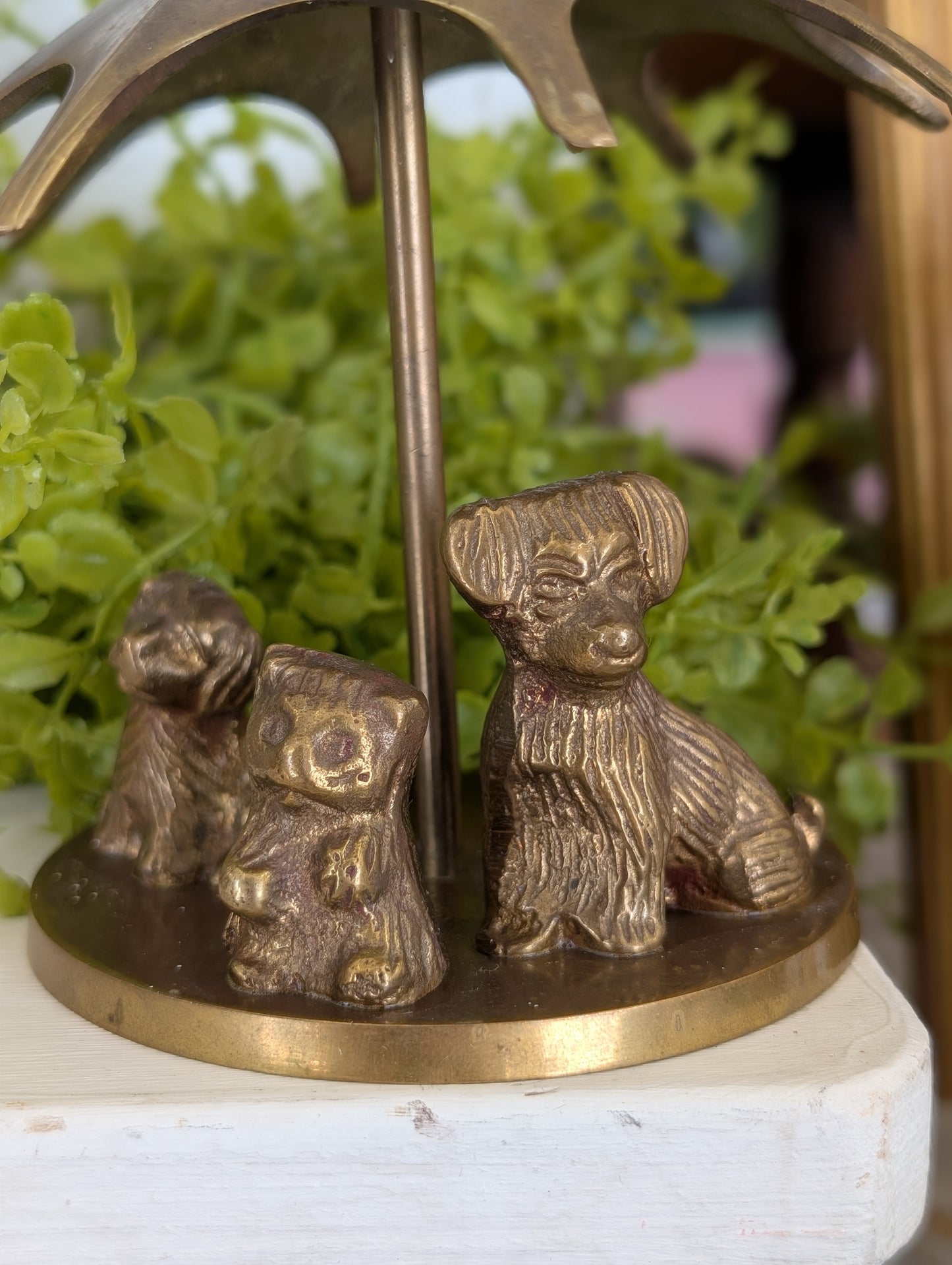 brass puppies with umbrella
