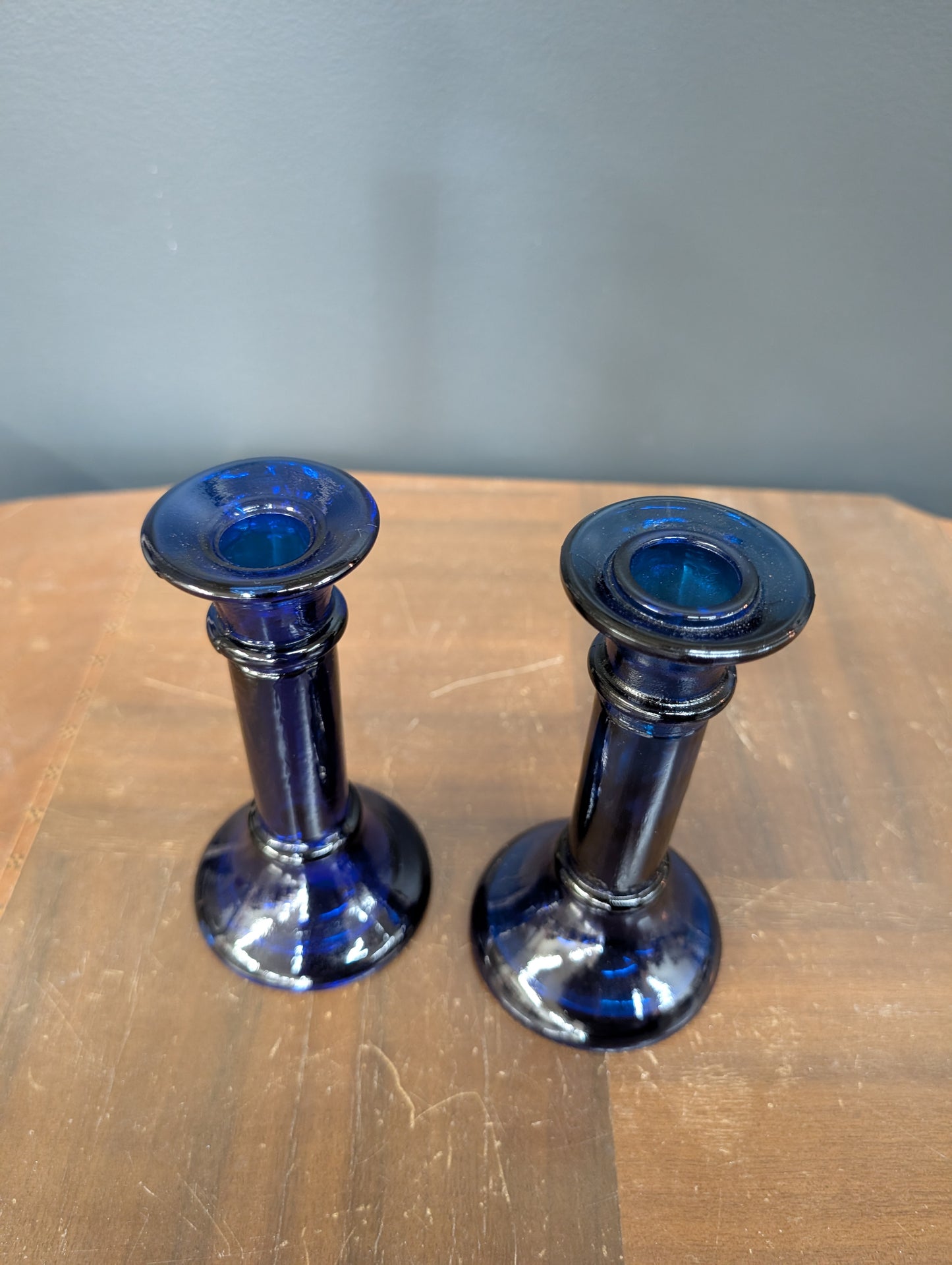 Set of blue glass candle sticks