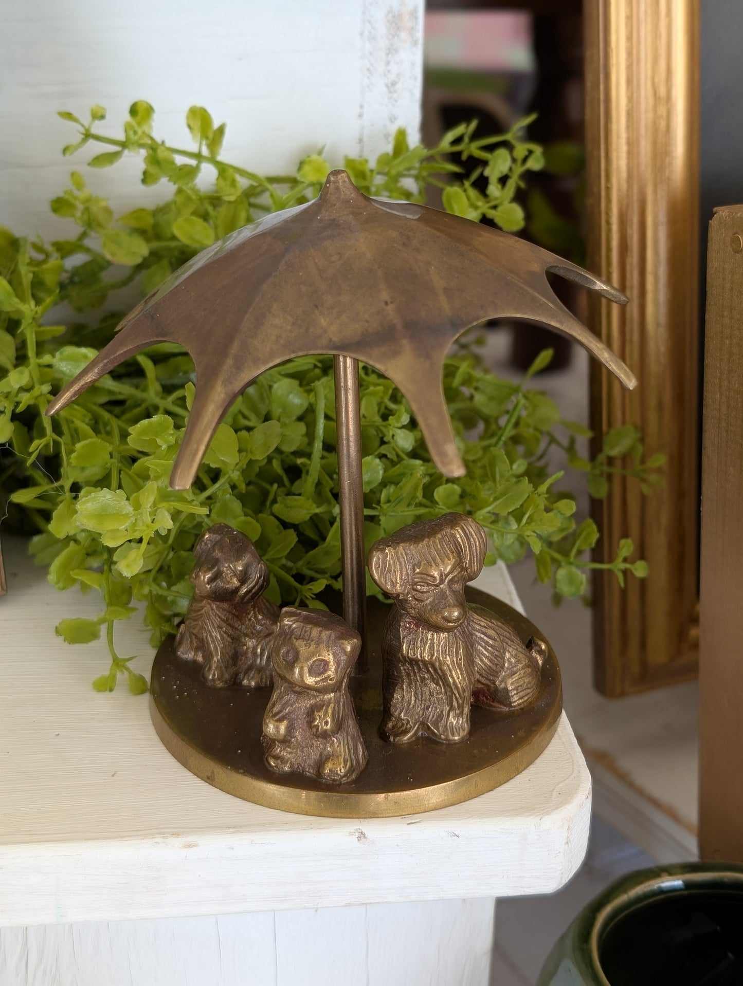 brass puppies with umbrella