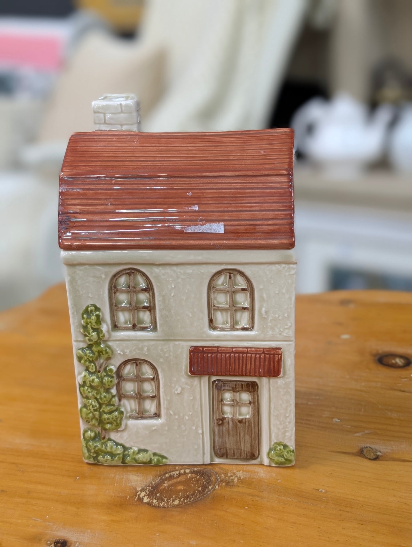 a vintage Otagiri ceramic house-shaped container with a red roof