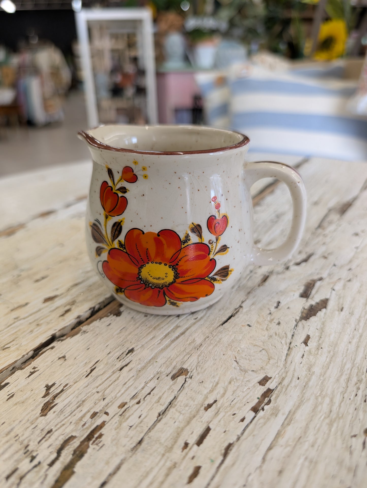 Creamer orange flower