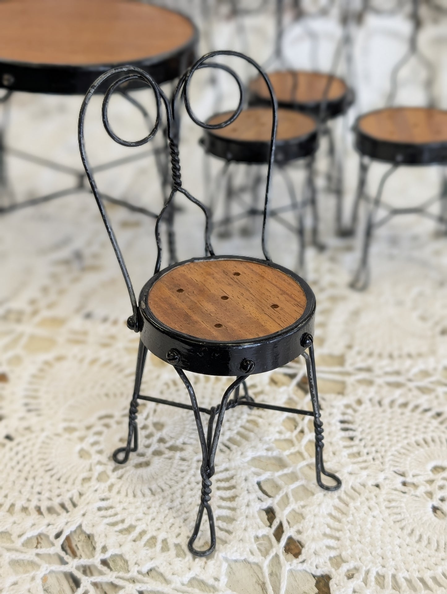 wrought iron and wood miniature bistro set with four chairs