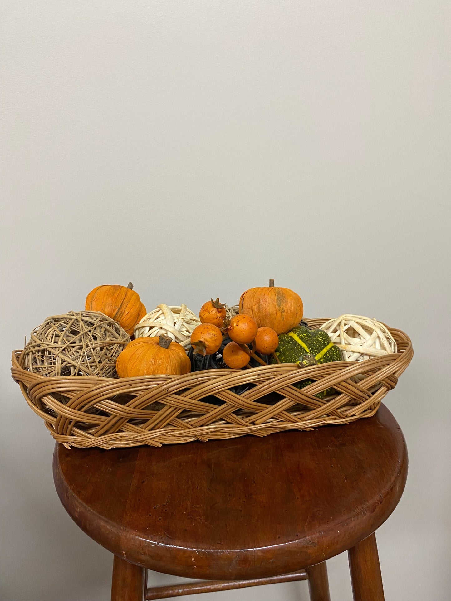 oval wicker basket with fall decorations - 1