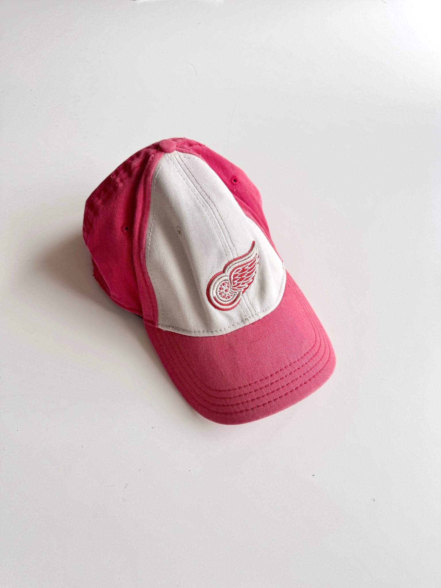 665f5e7d04f32b049949ecdf_hat-red-wings-2-copy_1776907273162.jpg