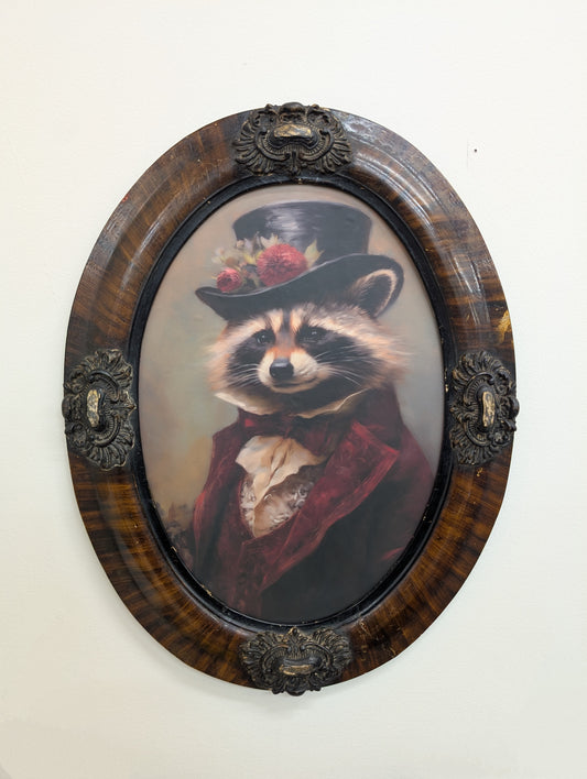 Antique oval frame with dapper Raccoon print