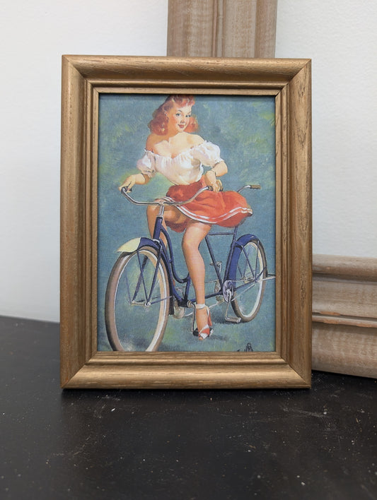 Girl on bike framed print