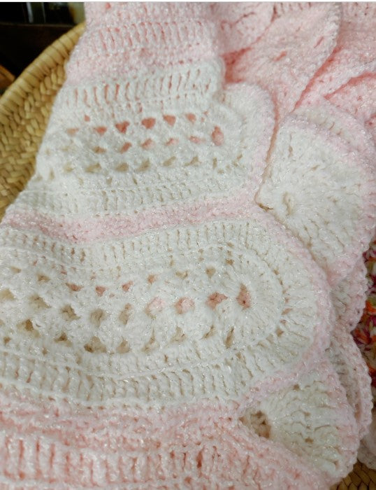 Pink and white baby blanket