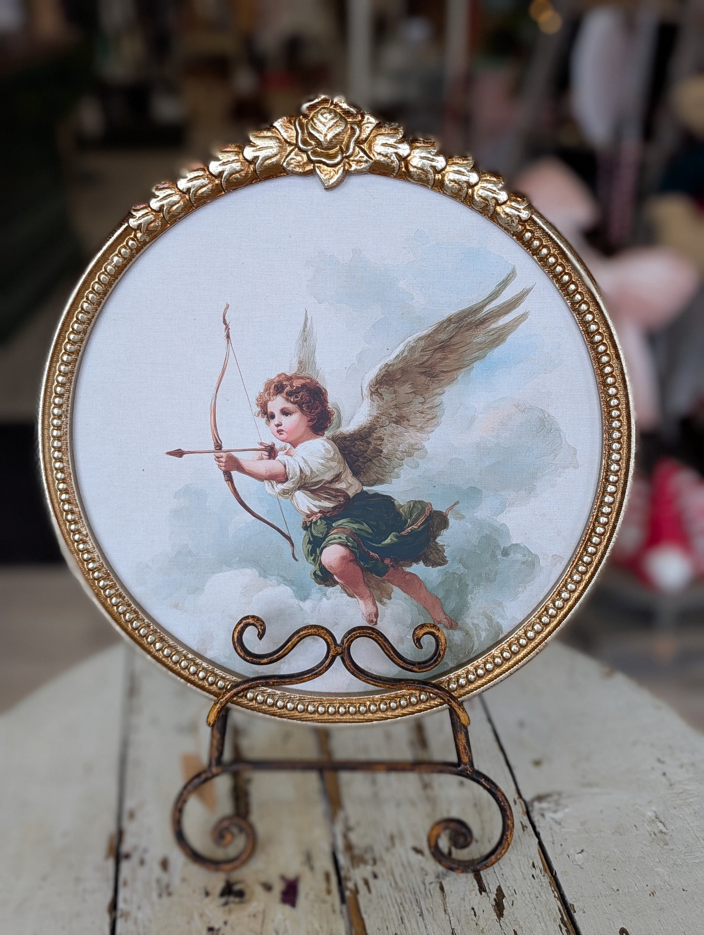 Round cupid framed print