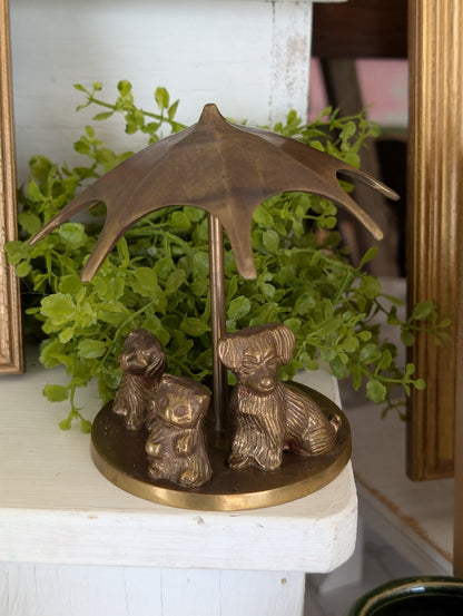 brass puppies with umbrella