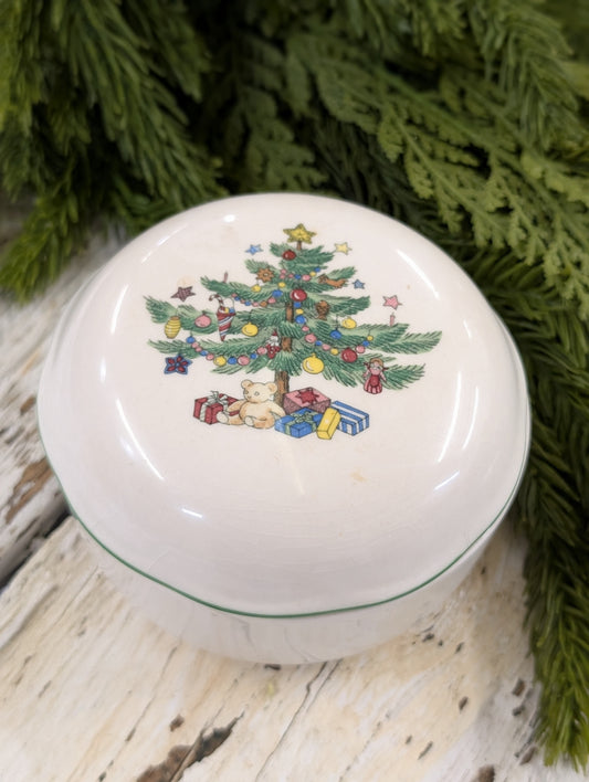 A vintage Nikko Fine China Christmas trinket box with a tree motif.