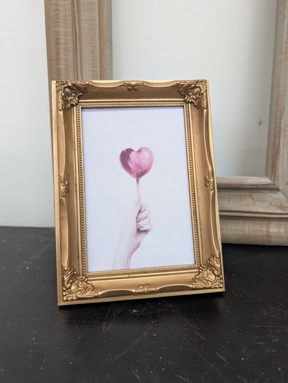 Heart balloon framed print