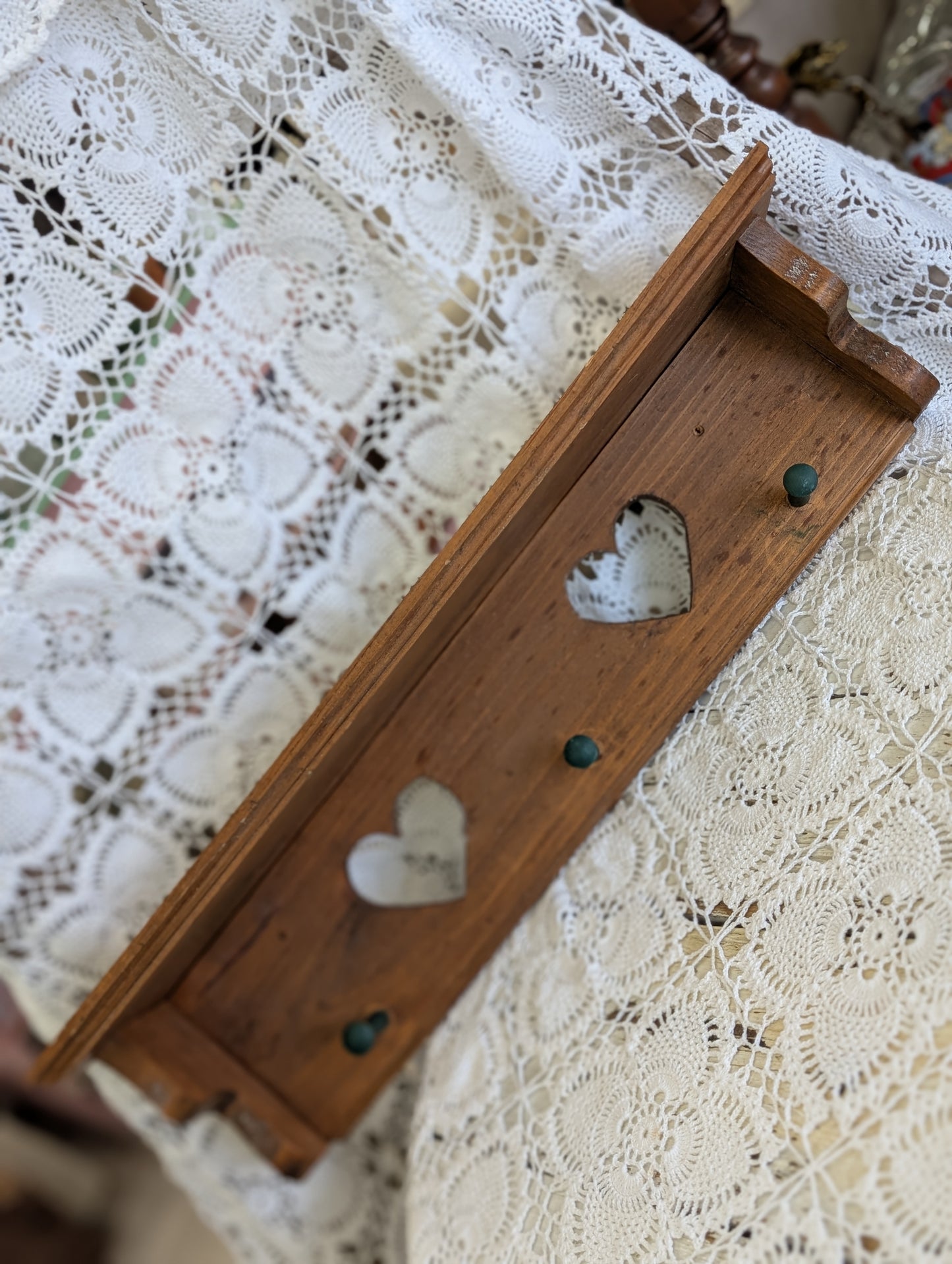 Wooden shelf with hearts