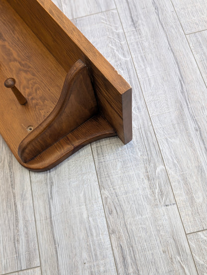 Wooden shelf with hooks