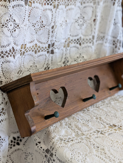 Wooden shelf with hearts