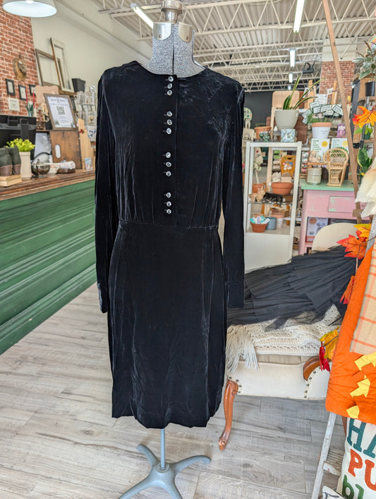 vintage Laura Ashley black velvet dress with decorative buttons.