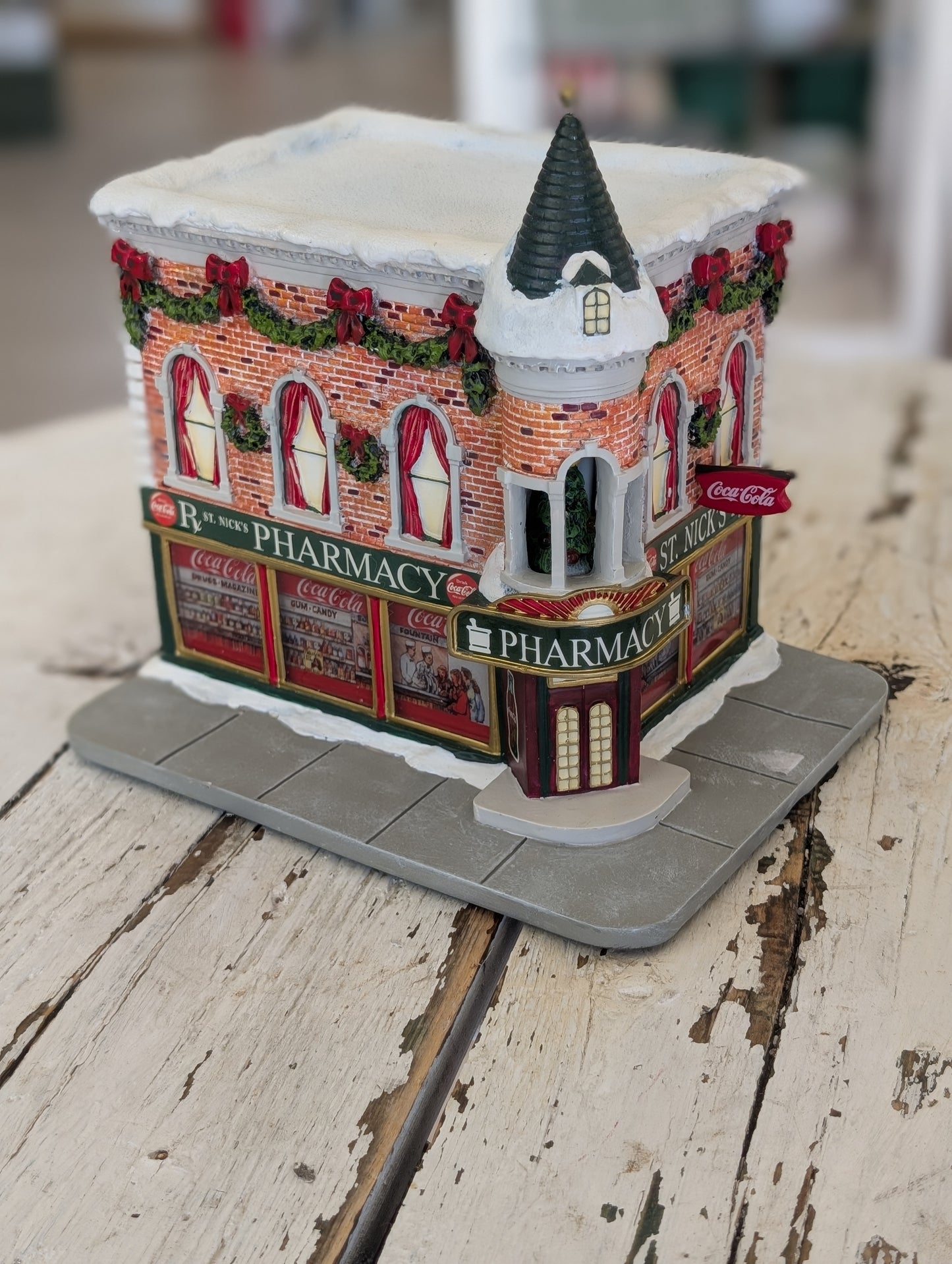 Hawthorne Village Coca-Cola St. Nick's Pharmacy holiday village building
