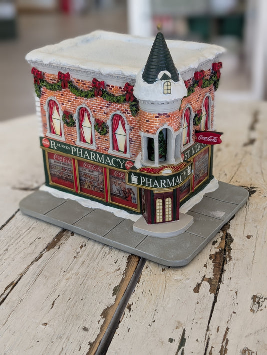 Hawthorne Village Coca-Cola St. Nick's Pharmacy holiday village building
