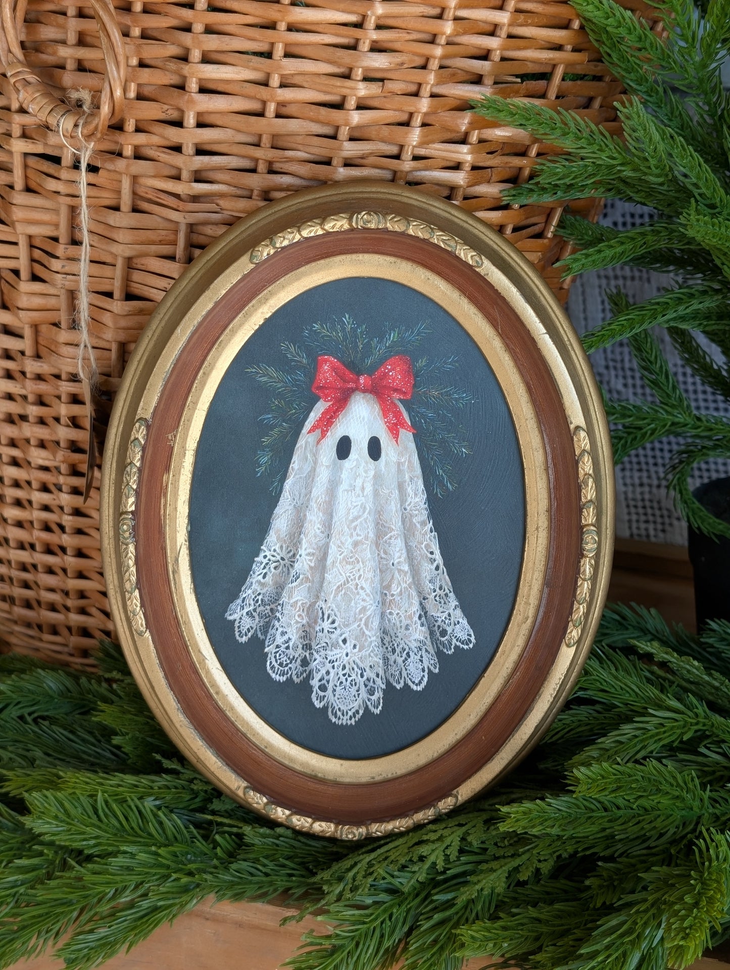 Festive ghost in oval frame