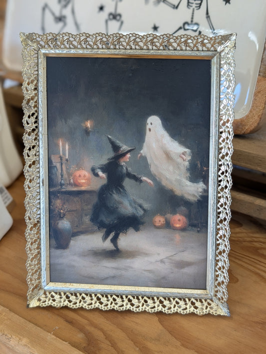 Dancing witch and ghost framed print