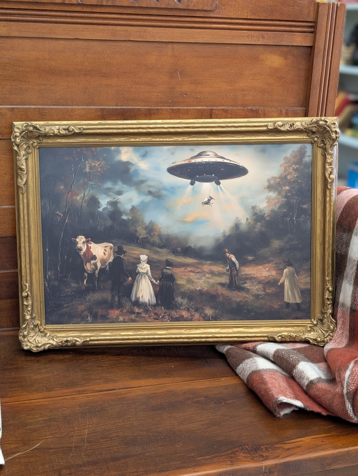 Framed alien with cows print