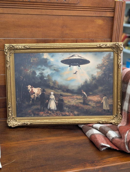 Framed alien with cows print