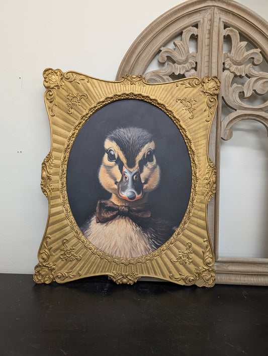 large duckling with bowtie framed art