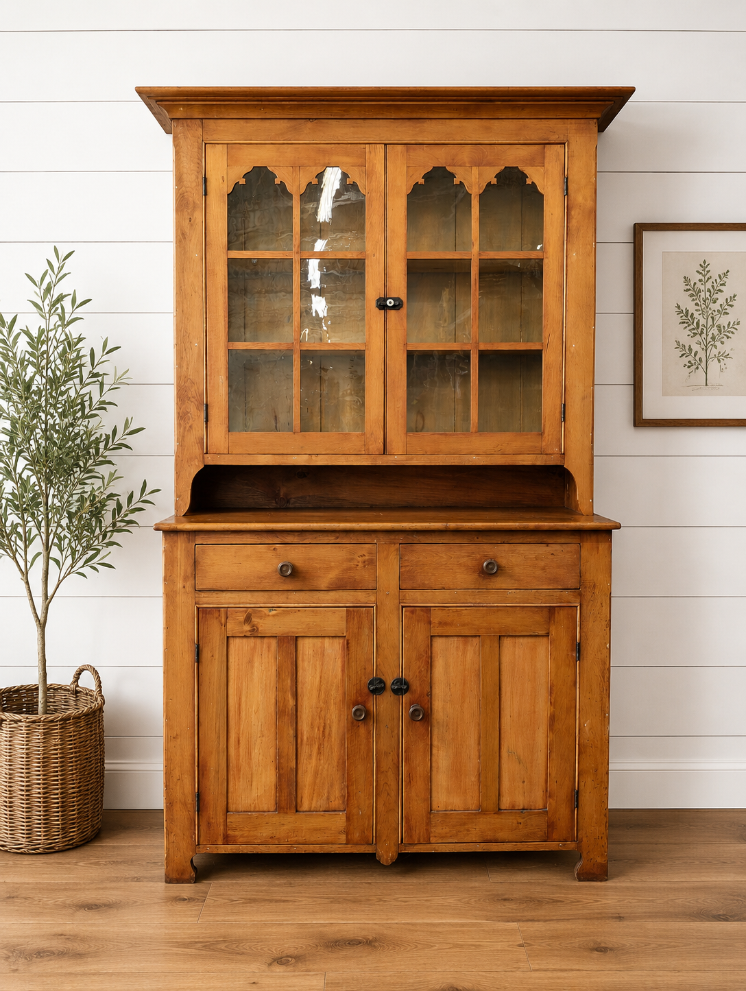 A two-piece Canadian pine cupboard with glass and solid doors