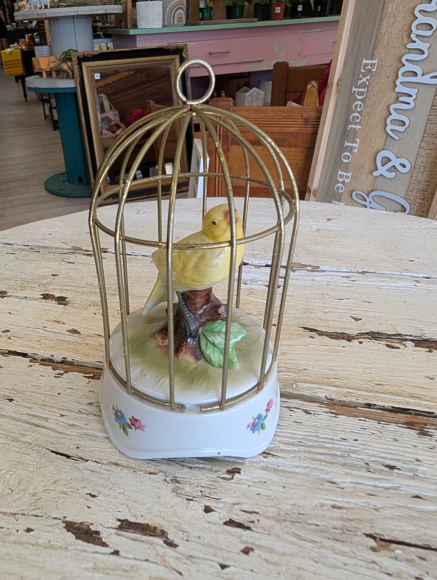 Ceramic bird in cage