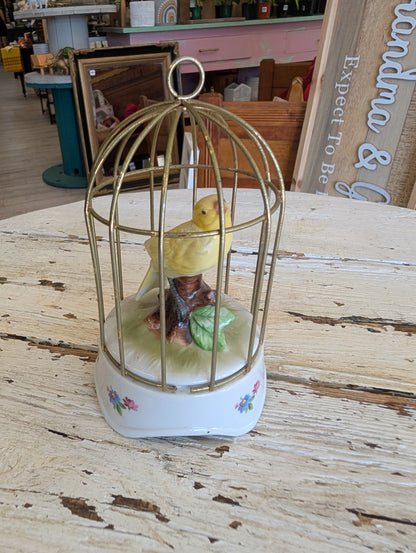 Ceramic bird in cage