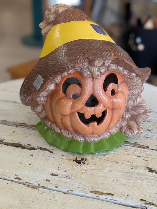 Pumpkin head scarecrow