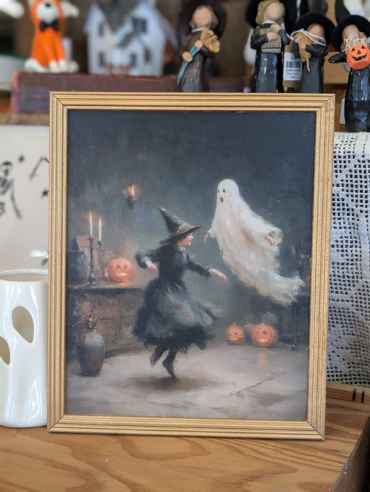 Dancing ghost and witch framed print