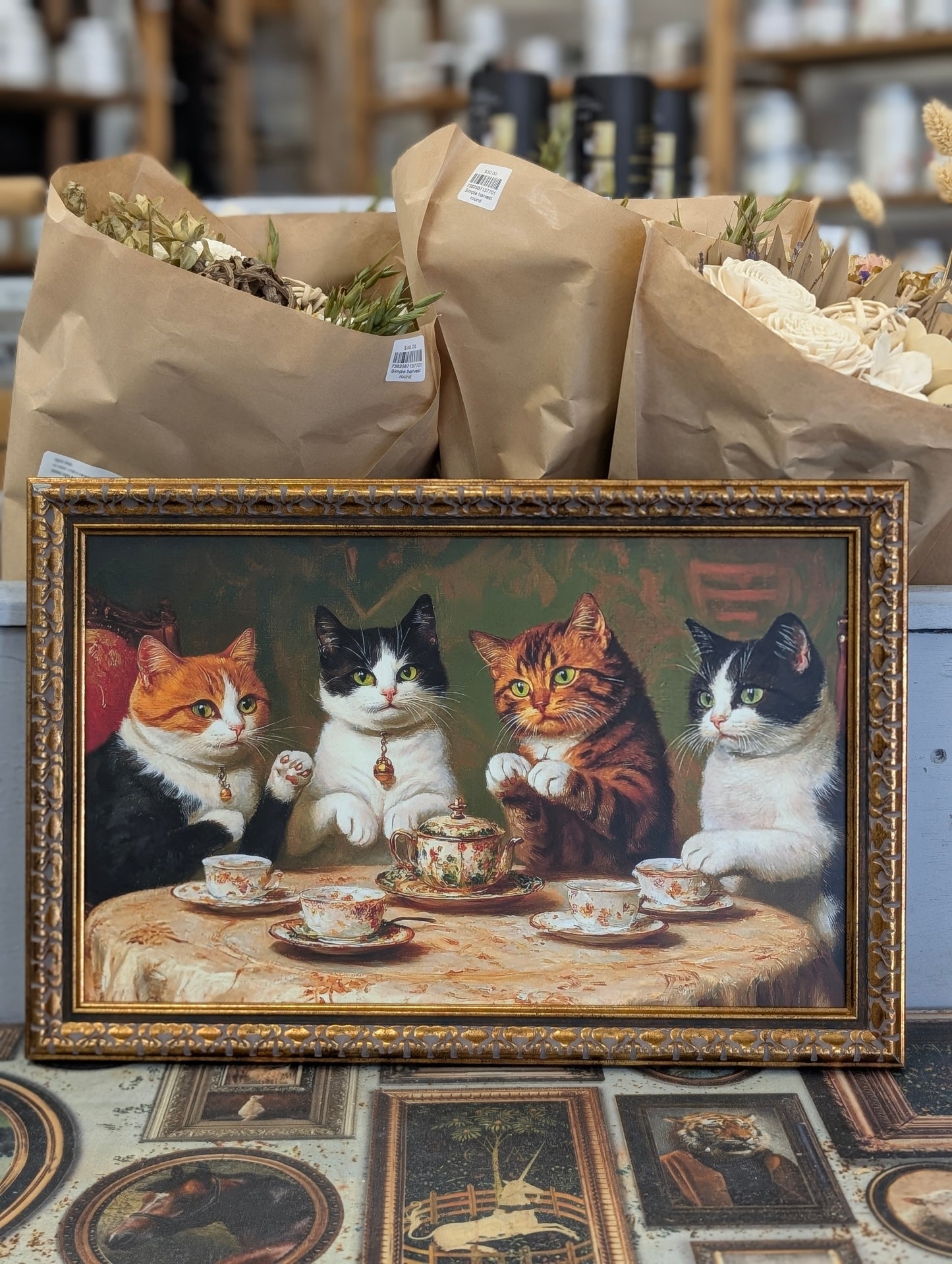 Kitties having tea framed print