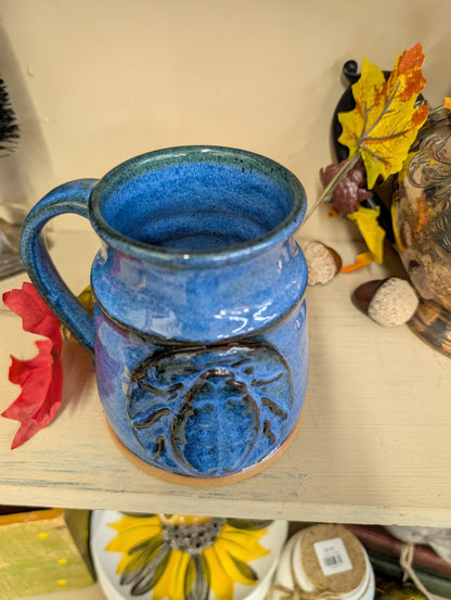 Blue pottery mug