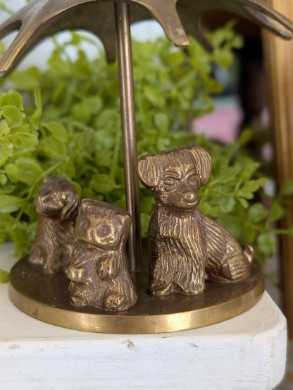 brass puppies with umbrella