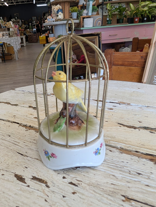 Ceramic bird in cage