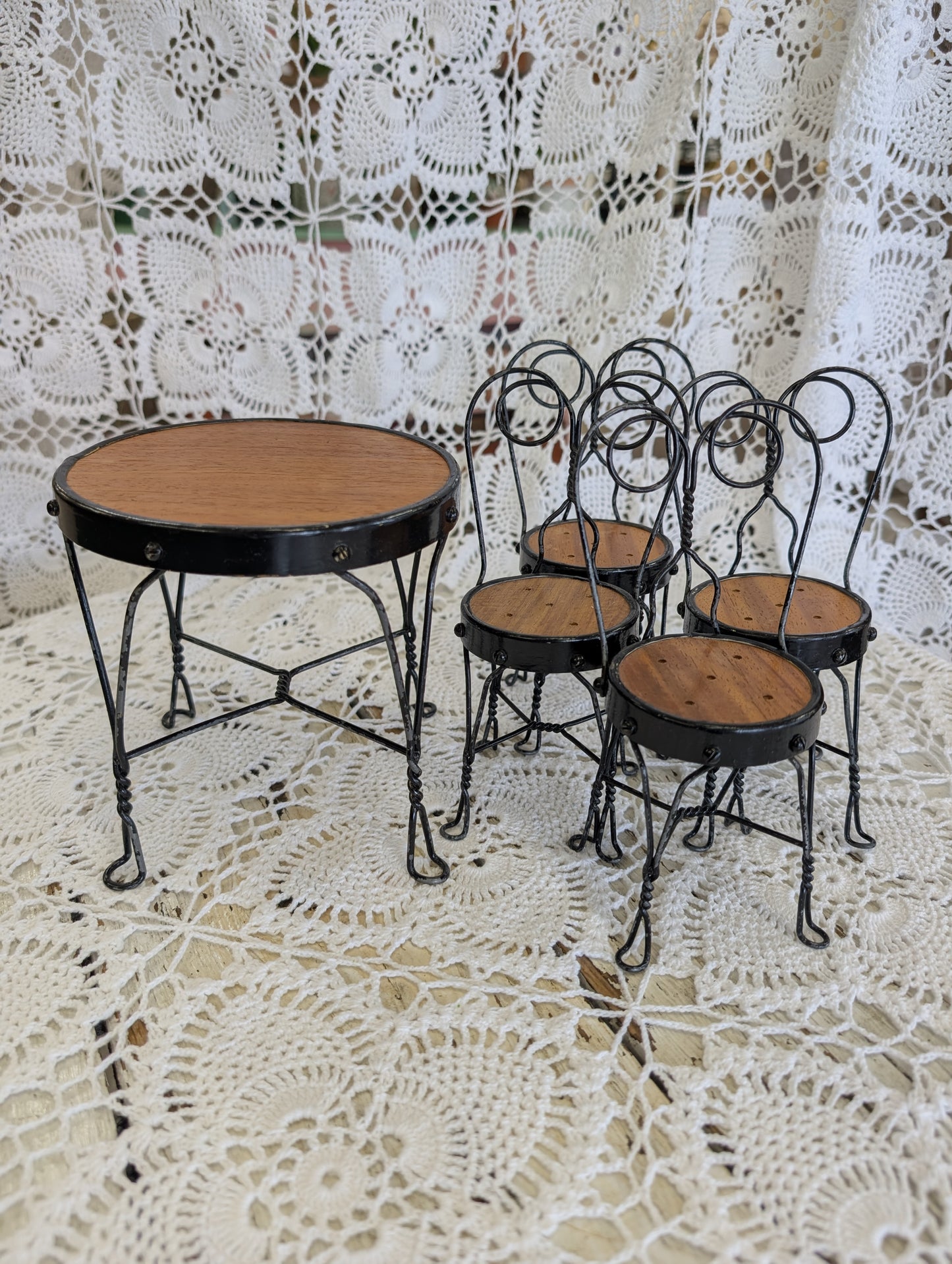wrought iron and wood miniature bistro set with four chairs