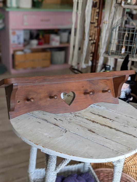 wooden shelf with hooks