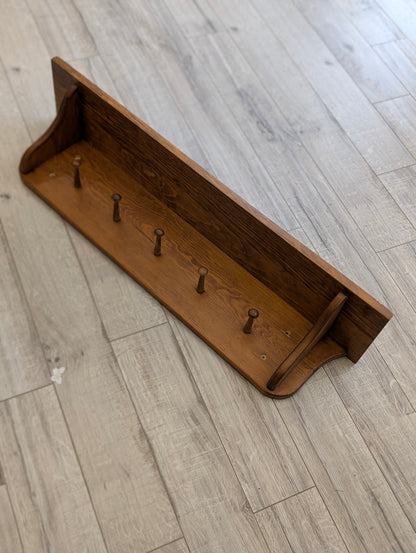 Wooden shelf with hooks
