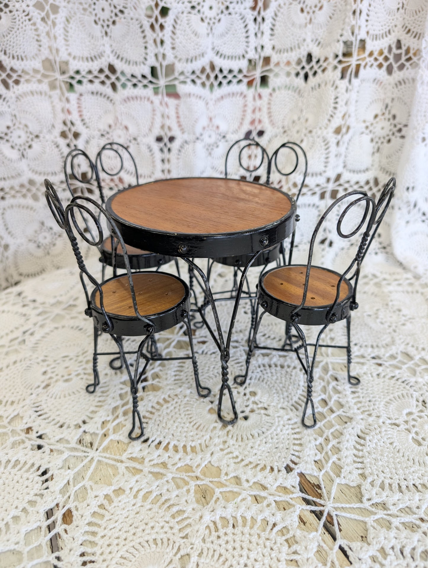 wrought iron and wood miniature bistro set with four chairs