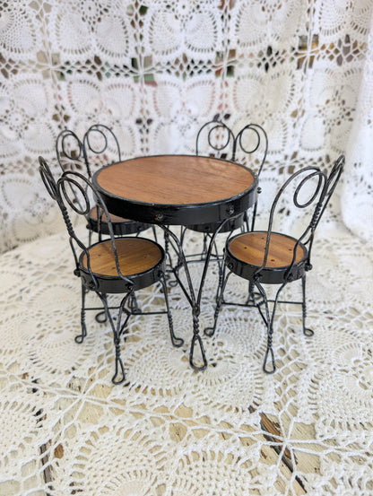 wrought iron and wood miniature bistro set with four chairs