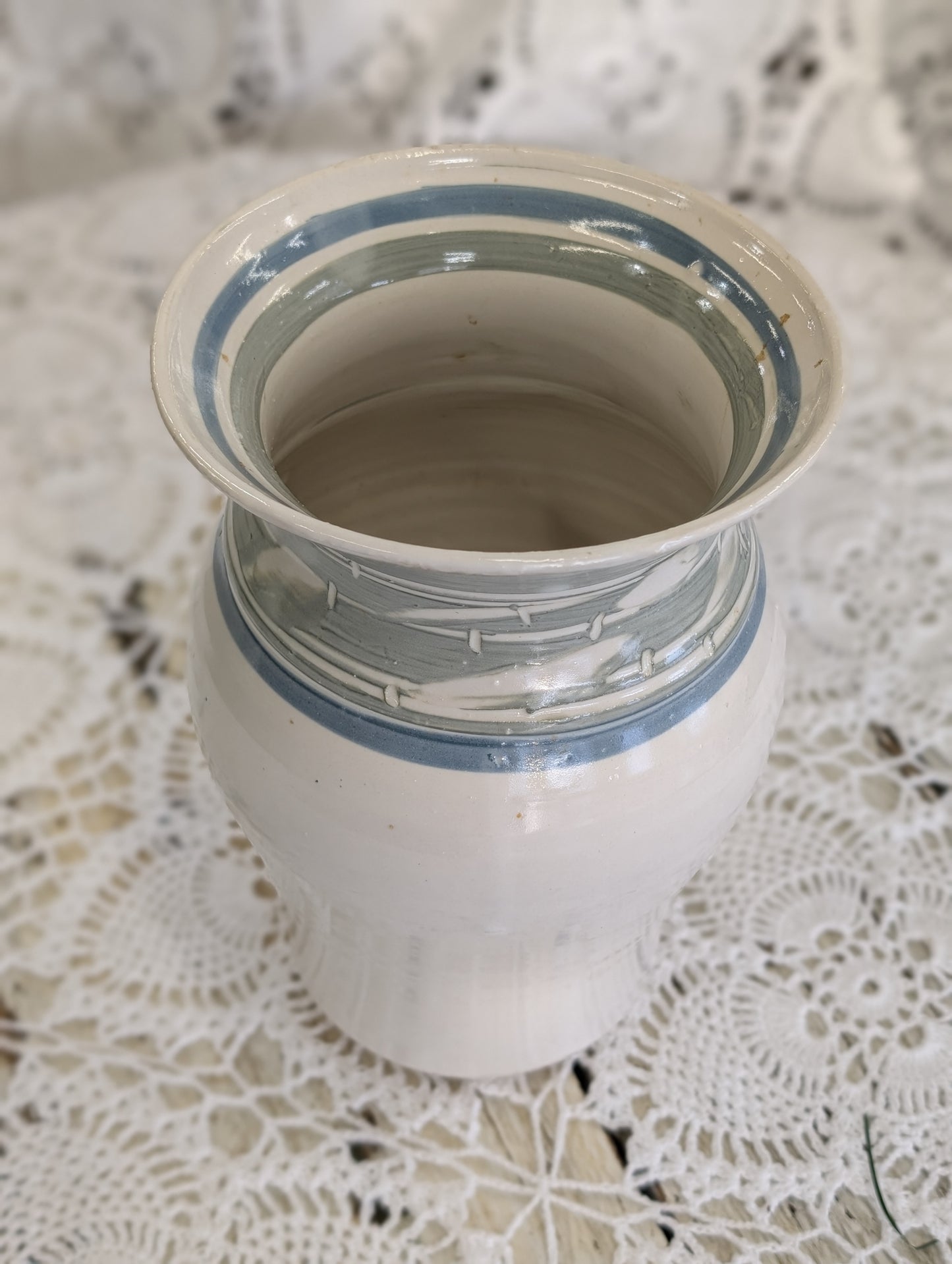 Handmade studio pottery vase with white glaze and blue/gray bands